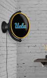 UCLA Bruins: Original Oval Rotating Lighted Wall Sign - Black - ONLINE ONLY!